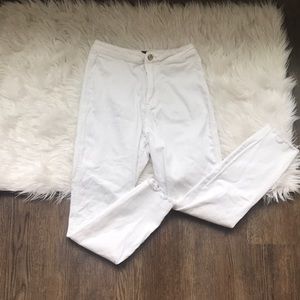 High waisted white jeans with distressed bottom